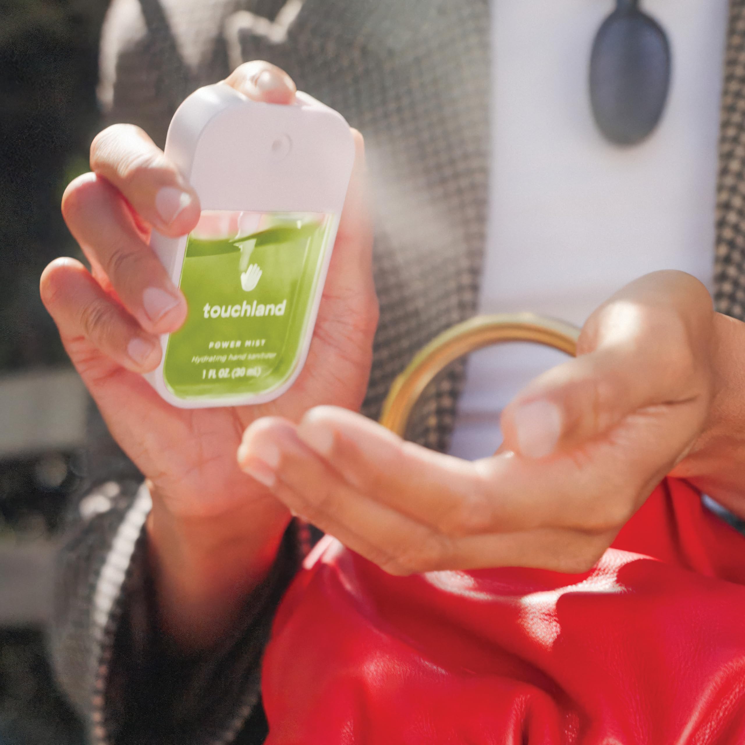 Touchland label close-up with ingredient callouts and ethical product badges