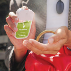 Touchland label close-up with ingredient callouts and ethical product badges