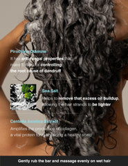 TOUN28 shampoo bar in hand showing compact size and travel convenience
