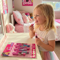 Townley Girl Barbie child applying gloss during playtime demonstrating safe, fun pretend makeup
