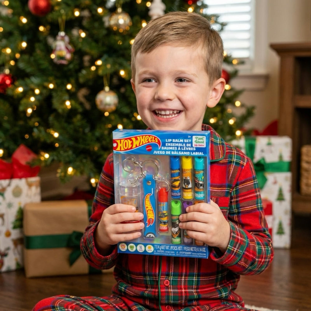 Townley Girl Hot Wheels lifestyle shot of kid holding balm showing playful use benefit: kid-approved design
