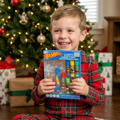 Townley Girl Hot Wheels lifestyle shot of kid holding balm showing playful use benefit: kid-approved design