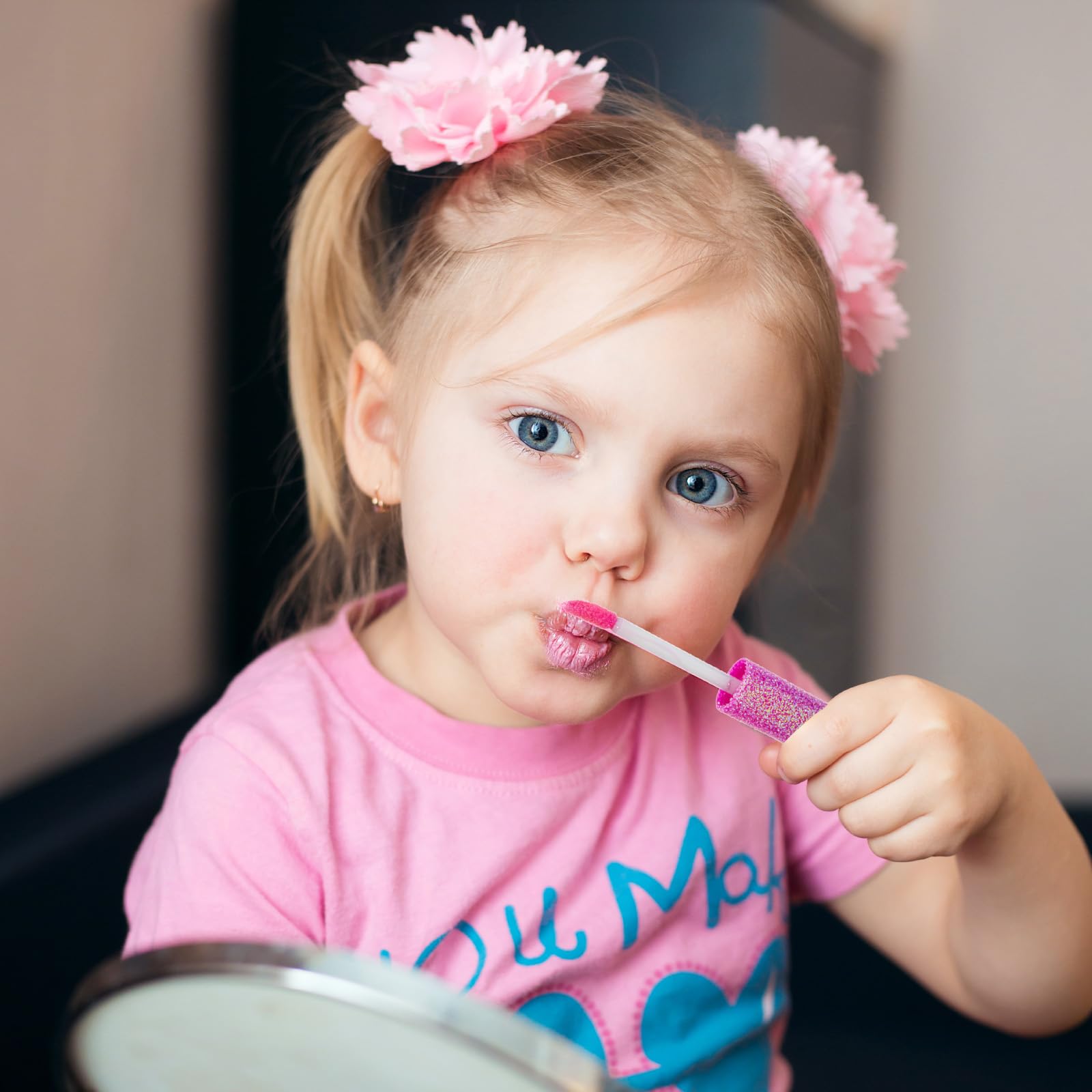 Townley Girl child applying gloss with adult supervision for safe play