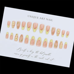 Toypoels hand applying a press-on nail demonstrating easy at-home use