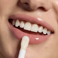 Tree Hut lip oil on lips in lifestyle scene for instant shine benefit