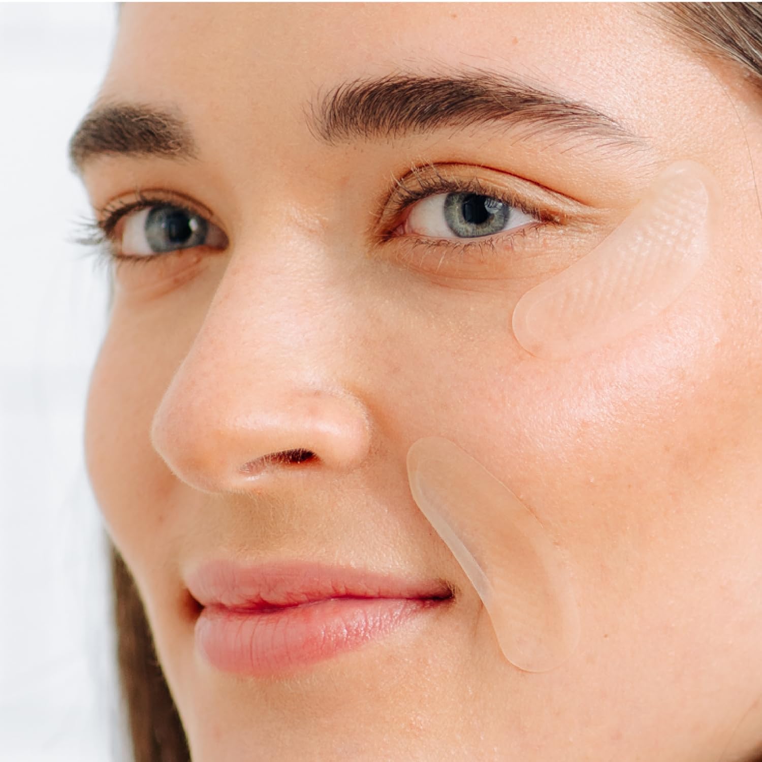 Tree of Life patch applied to forehead, demonstrates targeted smoothing benefit