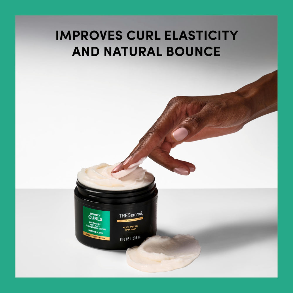 TRESemmé mask applied to curls demonstrating deep conditioning benefit
