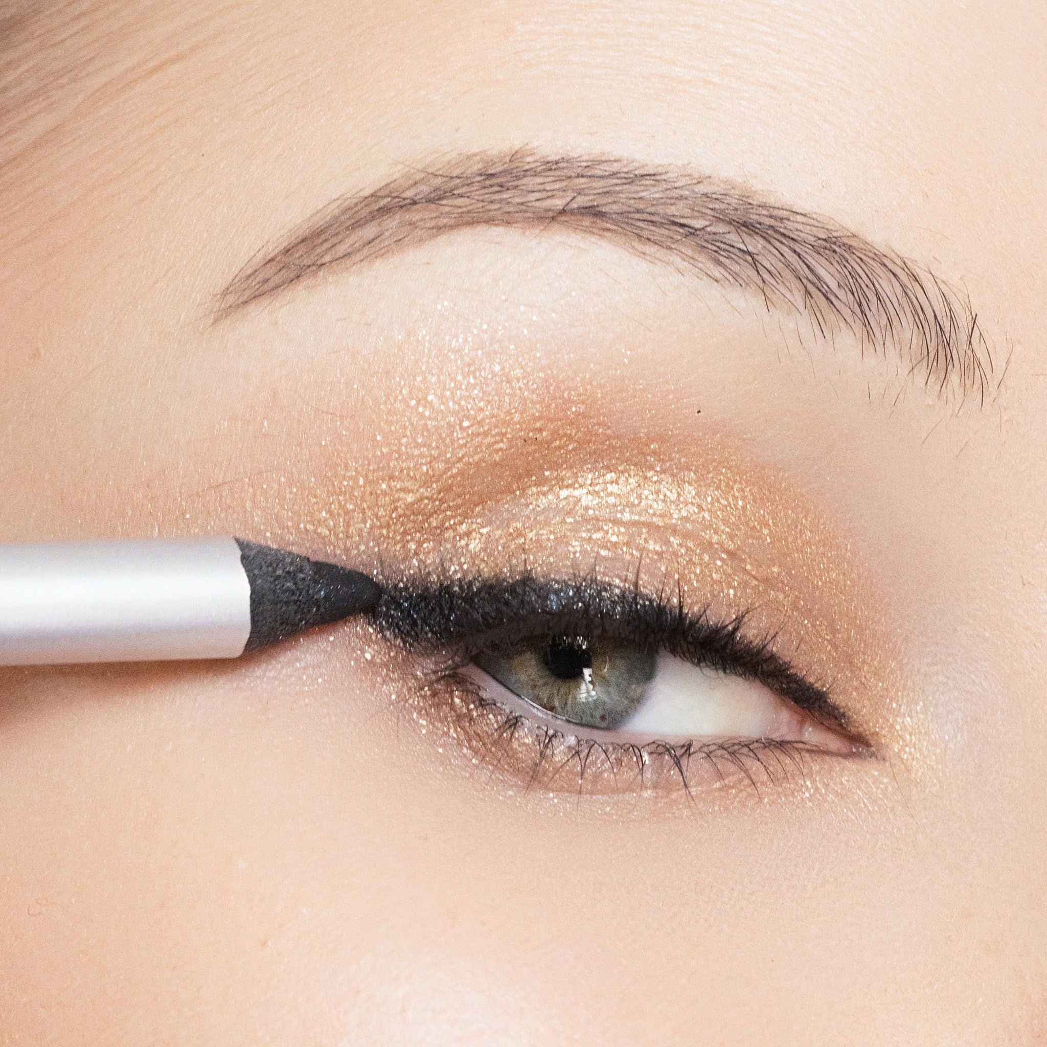 Trish McEvoy liner applied along lashline illustrating defined eye look and smudge resistance
