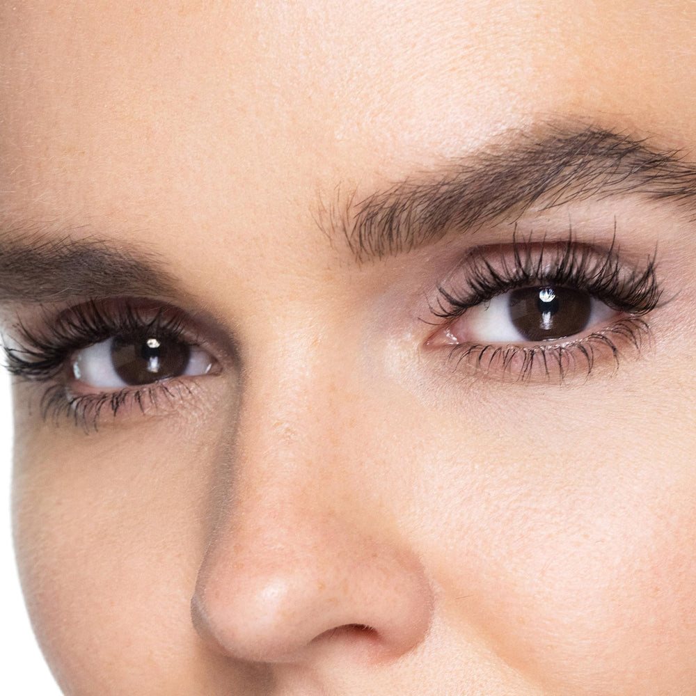 Trish McEvoy mascara inside a makeup bag staged lifestyle shot showing daily-ready, polished look