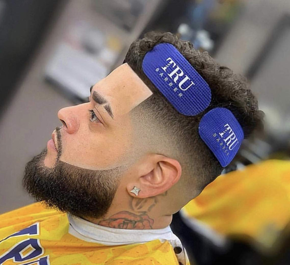 TRU BARBER grippers soaking in solution illustrating easy cleaning and hygiene benefit