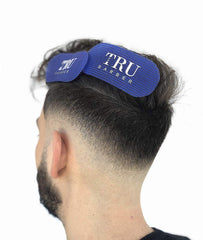 TRU BARBER gripper next to hand for size comparison showing compact portability benefit