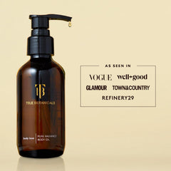 Bottle beside towel for size comparison showing True Botanicals travel-friendly volume