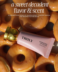 Truly gloss layered over lipstick boosting shine and color depth