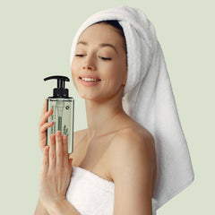 TS SHAMPOO bottle on shower shelf illustrating calming herbal shower experience