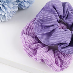 TUCEWP scrunchie beside a ruler to show 3.93 inch size and scale