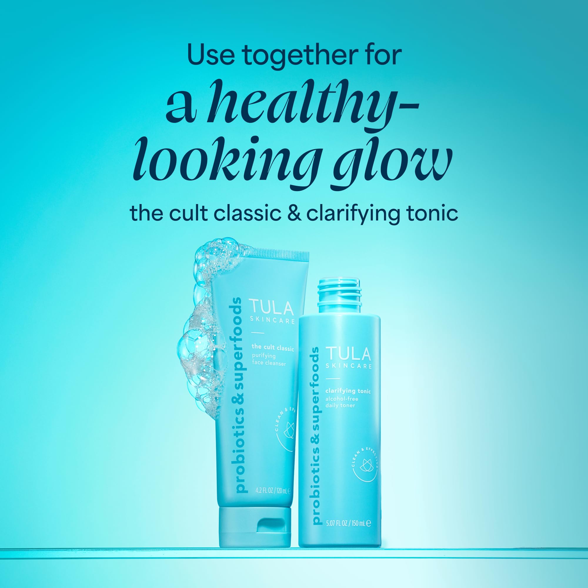 TULA mini clarifying tonic next to cleanser and serum flatlay showing layering benefit