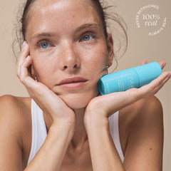TULA bottle on nightstand in lifestyle setting showing evening skincare use