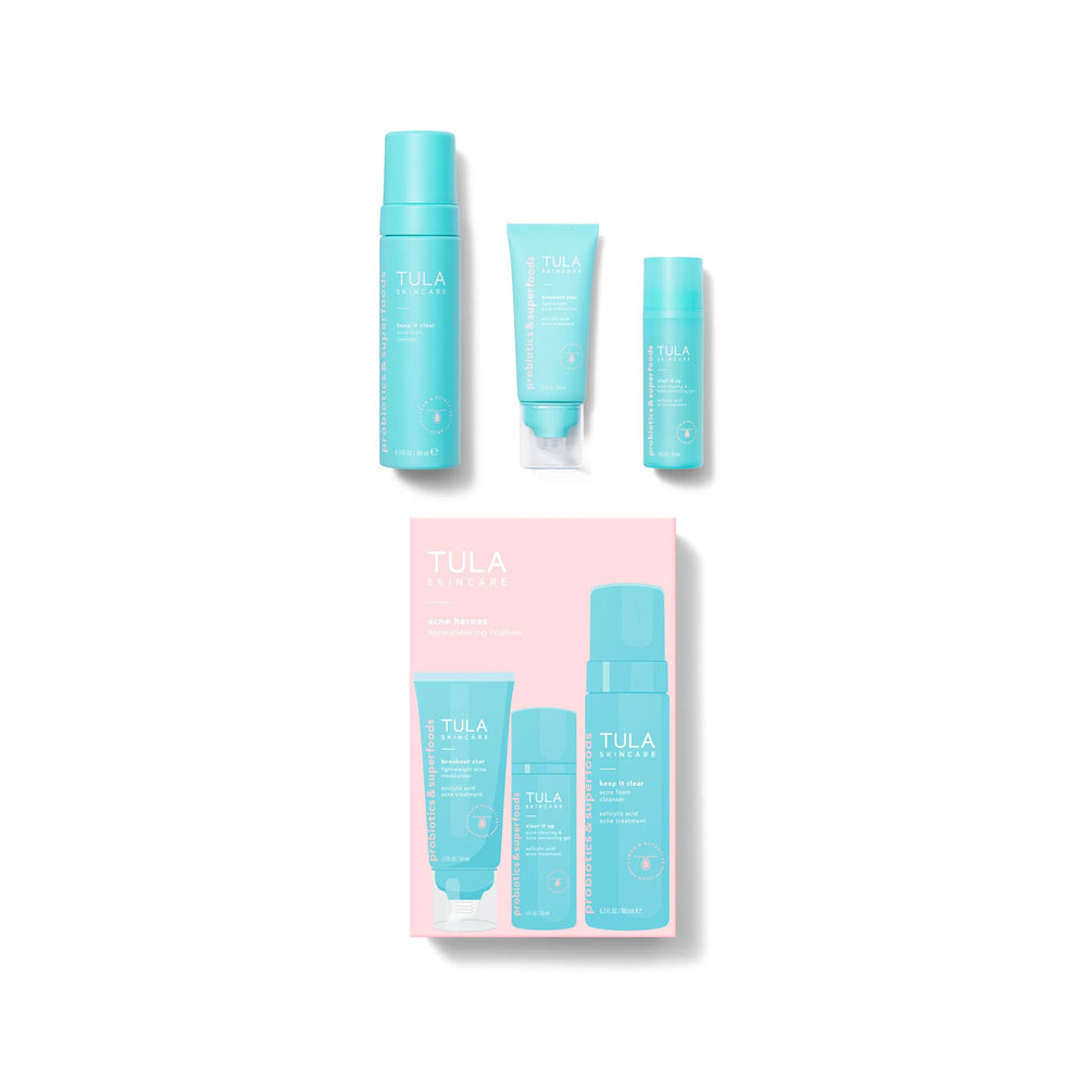 TULA kit beside hand for size comparison to show travel-friendly volumes