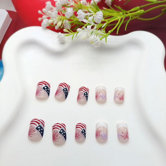 TUZANDW close-up of French tip and American flag design with glossy finish