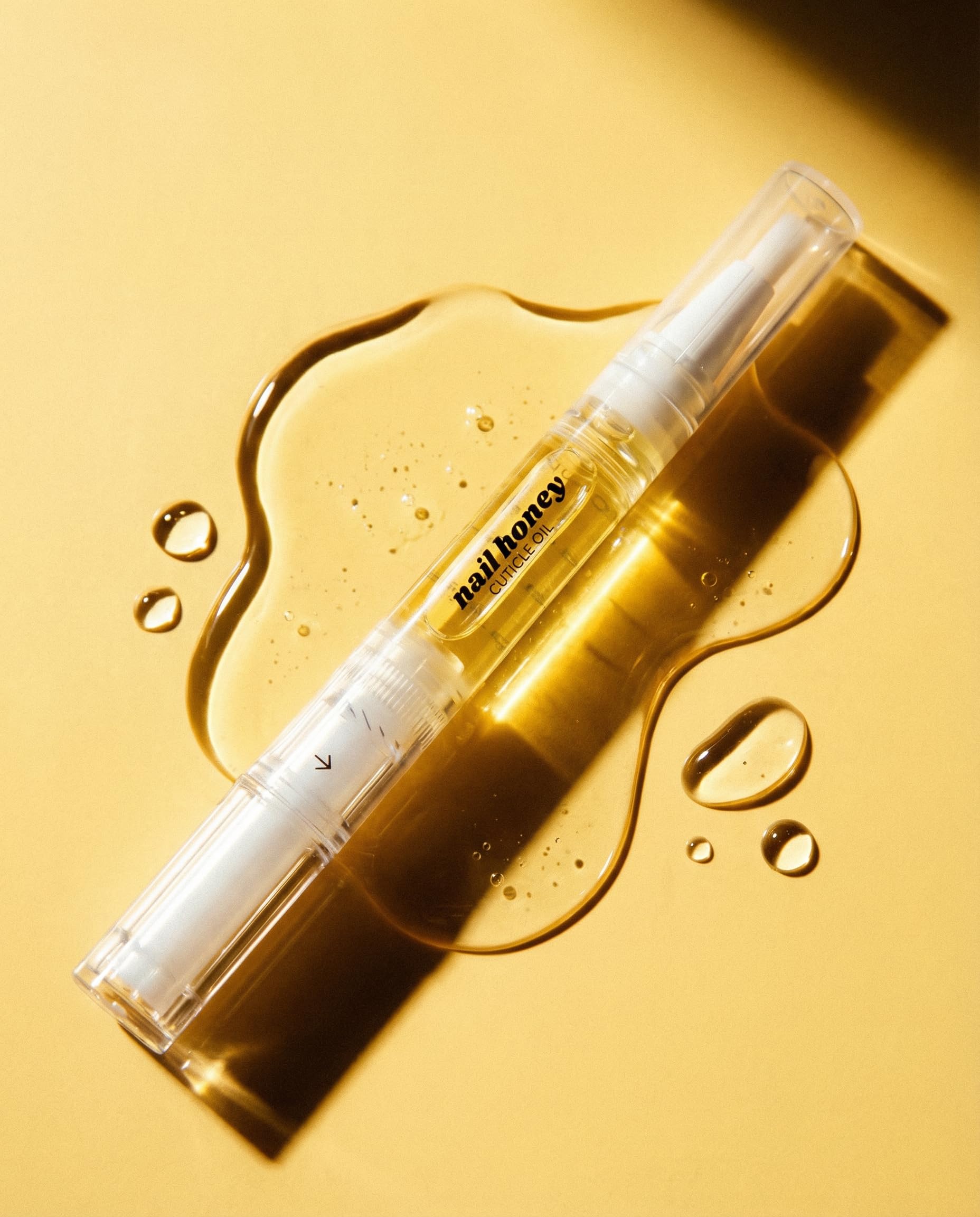Twinkled T arranged ingredient bottles showcasing organic oil blend benefit