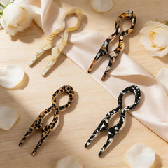 Twoheadpig pin inserted in a French twist showing hidden support and refined look