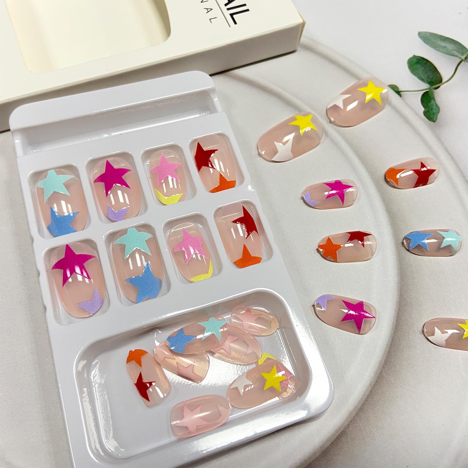 Tyuimhx hands applying a press-on nail with jelly glue, illustrating quick at-home application