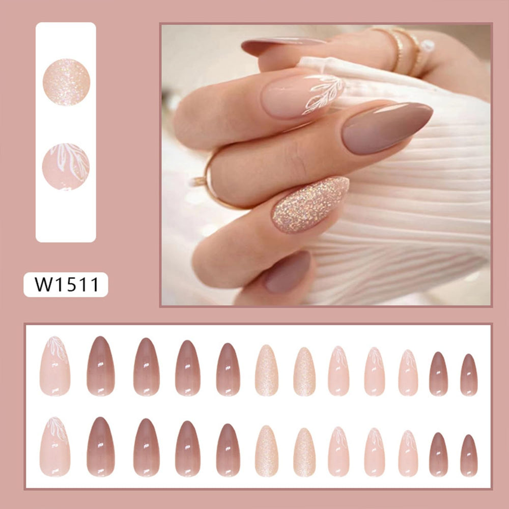 Tyuimhx close-up of leaf pattern and glitter on a nail showcasing glossy decorative detail