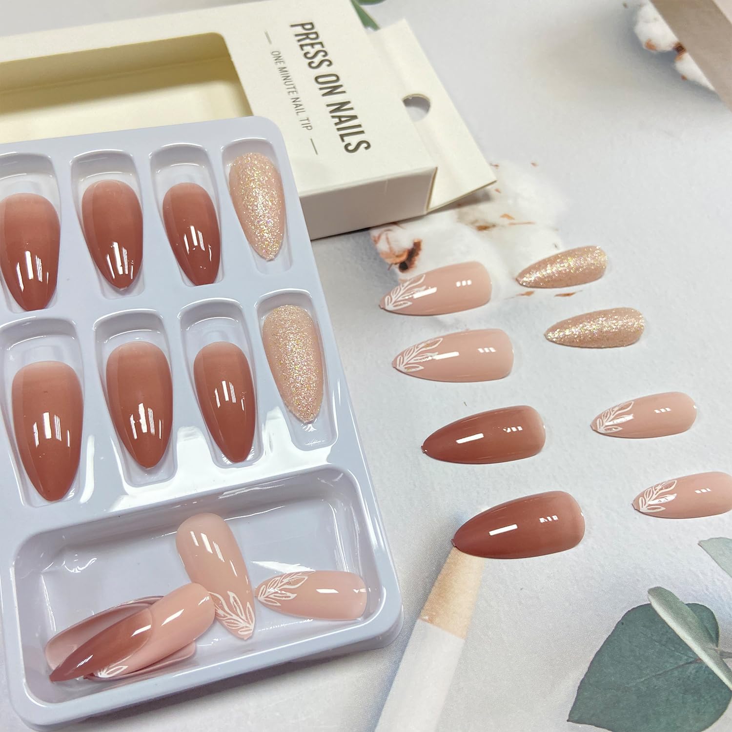Tyuimhx hand applying a press-on nail demonstrating quick salon-style application at home