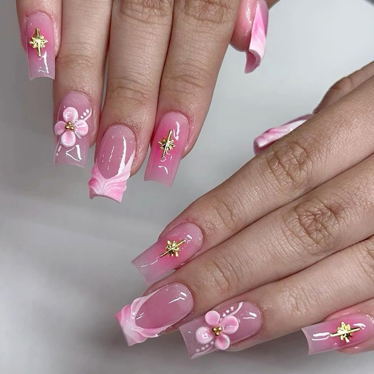 Tyuimhx charms beside a coin to illustrate scale and precision for delicate nail art