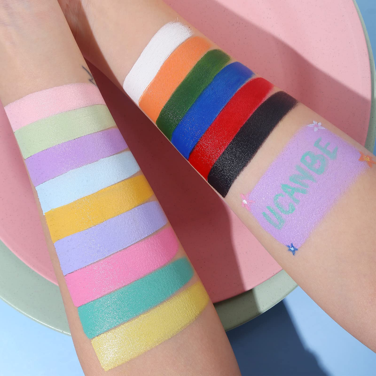 UCANBE applying paint on cheek to demonstrate precise application and color payoff