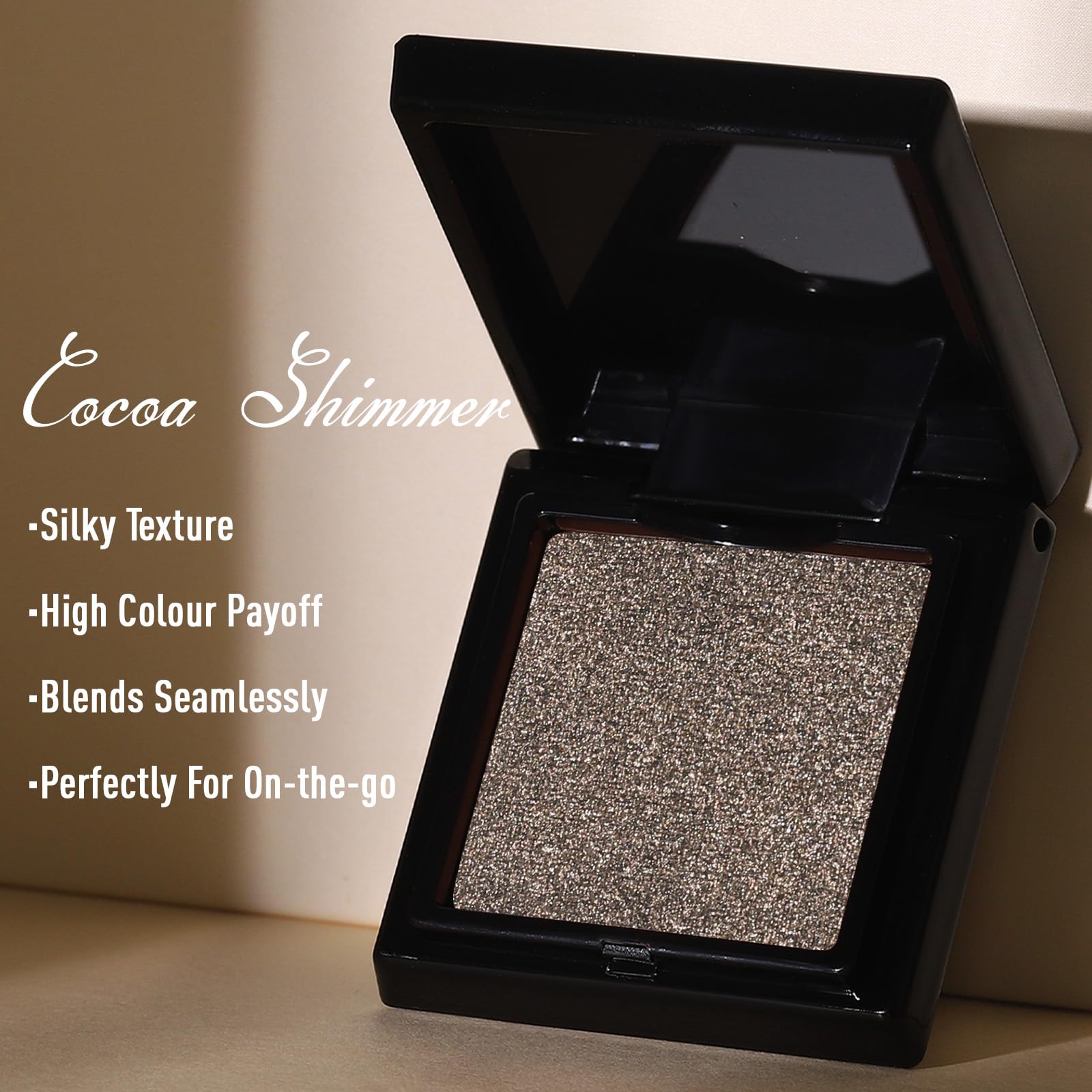 UCANBE cocoa brown shimmer next to a coin showing compact size for travel-friendly touch-ups