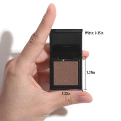 UCANBE pan shown next to coin illustrating compact, portable size