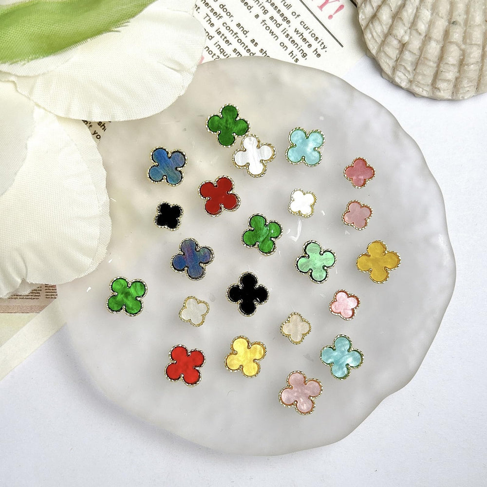 UCCASA labelled set of 12 clover charms neatly arranged showing variety benefit organized storage