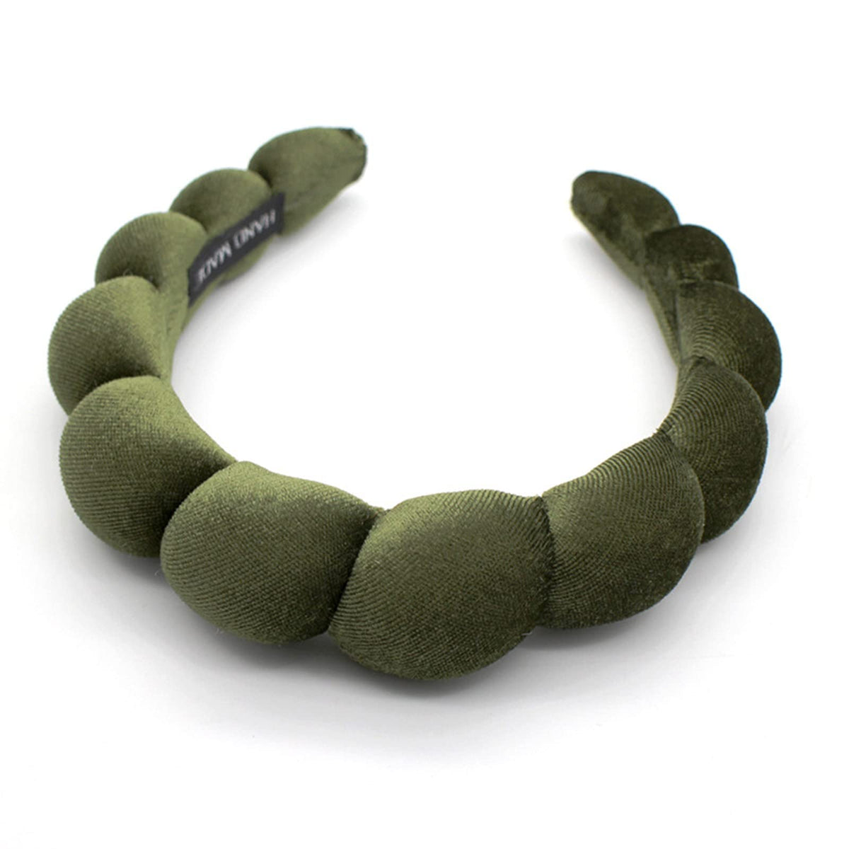 Uchyius headband front view showing leaf green velvet and polished look