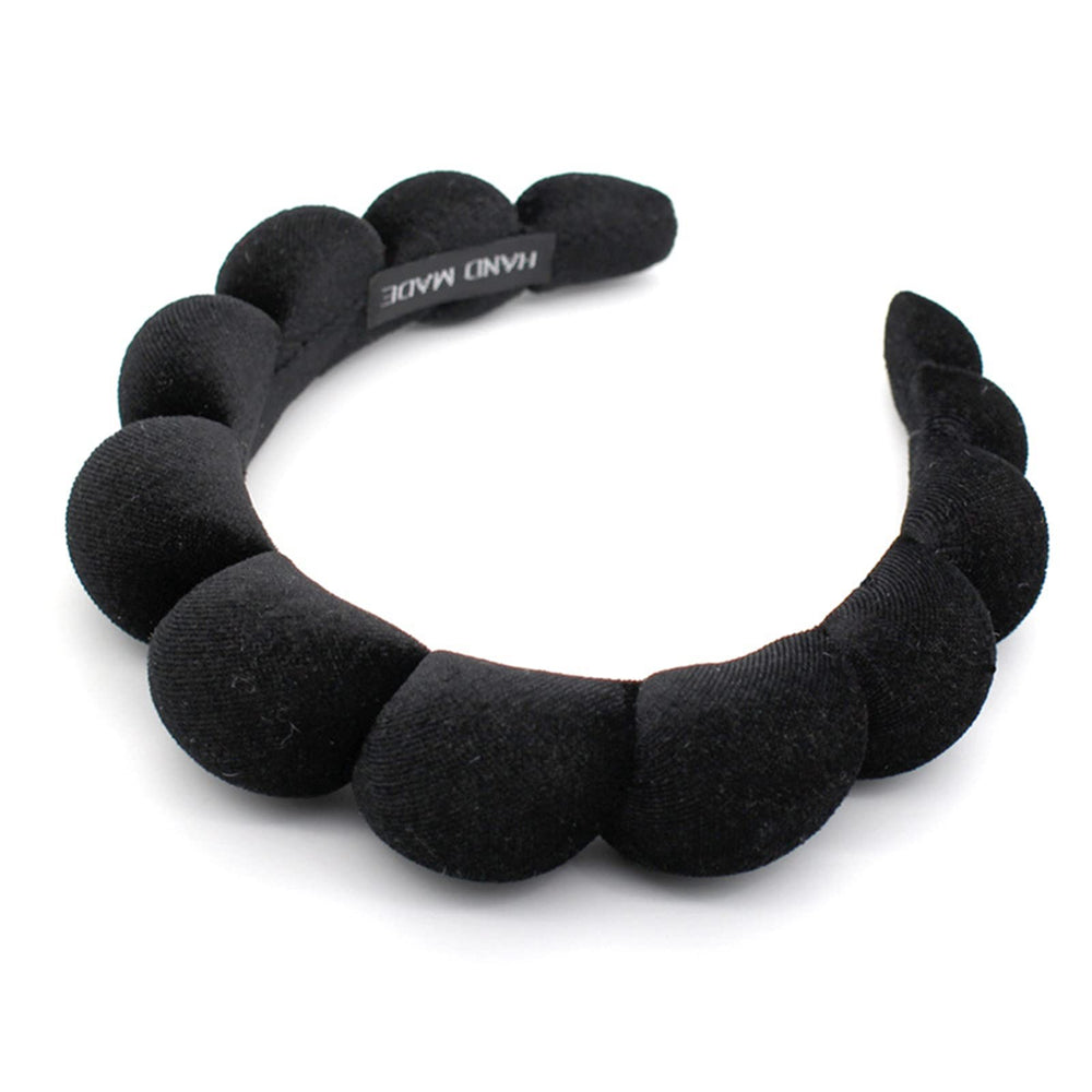 Uchyius headband front view showing sleek velvet finish and elegant style benefit