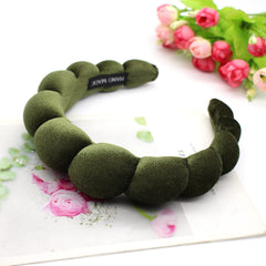 Uchyius headband worn outdoors showing secure non-slip hold