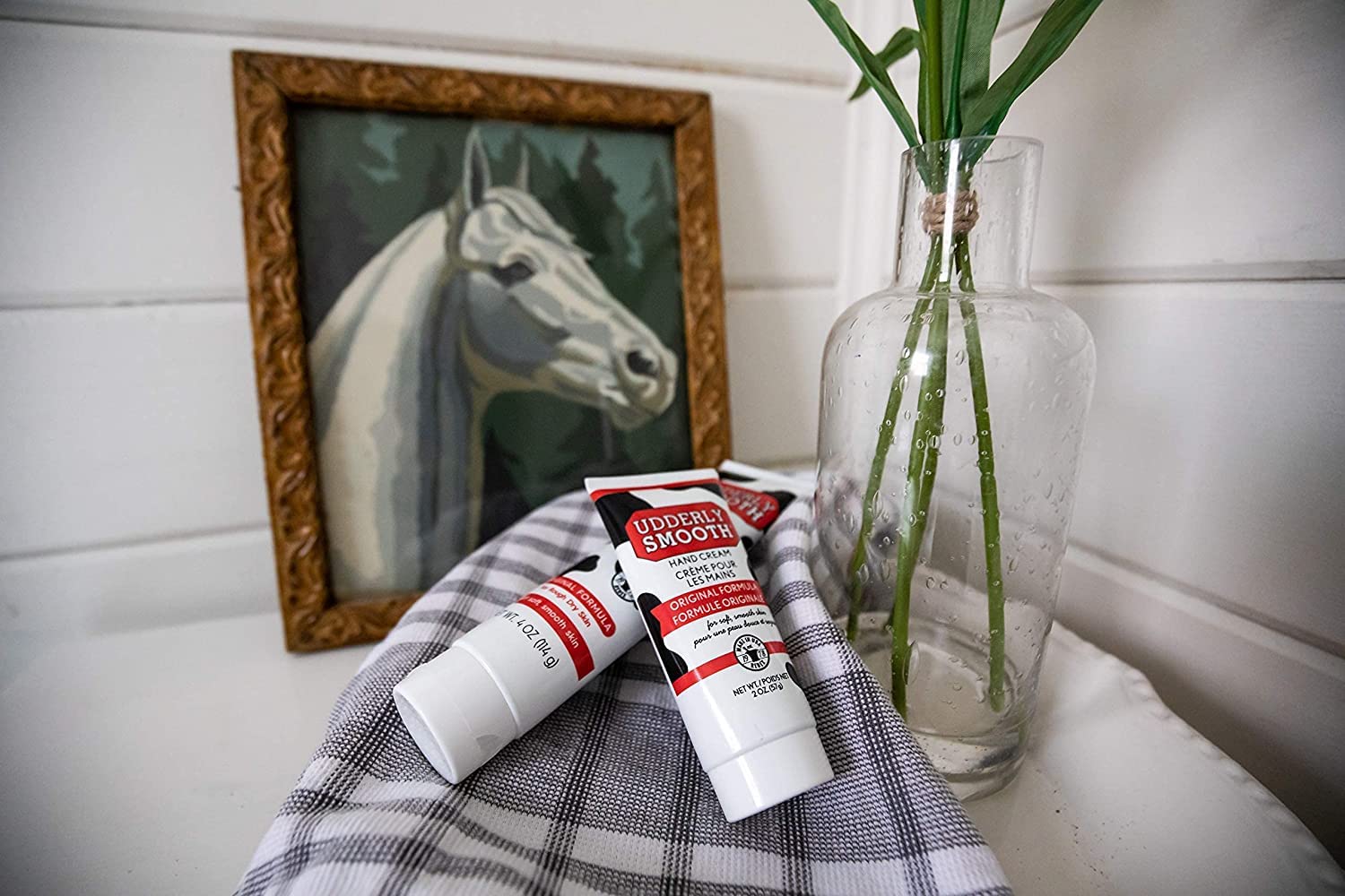 Udderly Smooth tubes on a bathroom counter showing everyday accessibility benefit