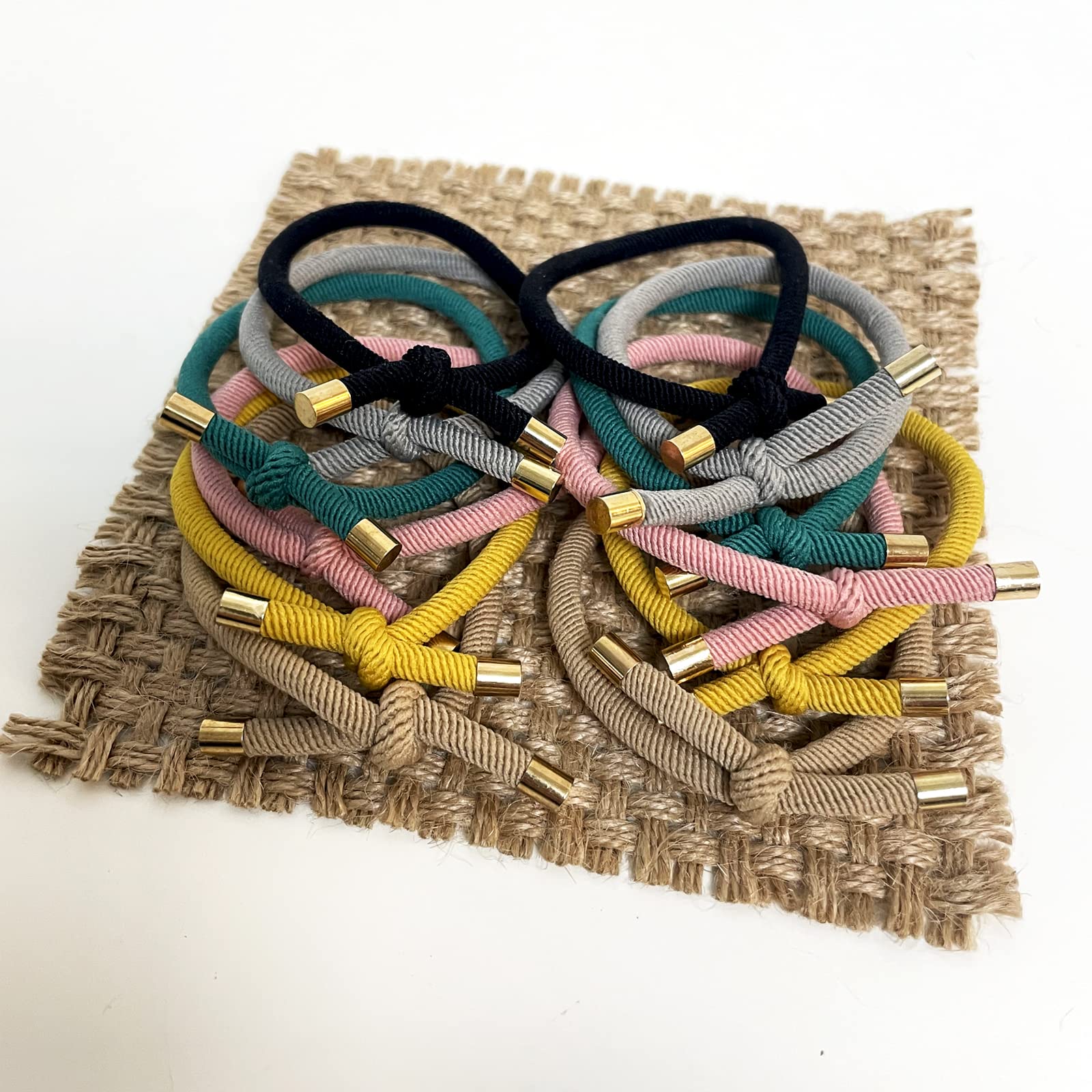 UDeBe hair tie held in hand for size and scale, showing easy portability