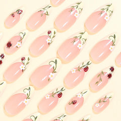 UEYRSEDB close-up of glossy almond nail texture highlighting smooth finish and natural look benefit