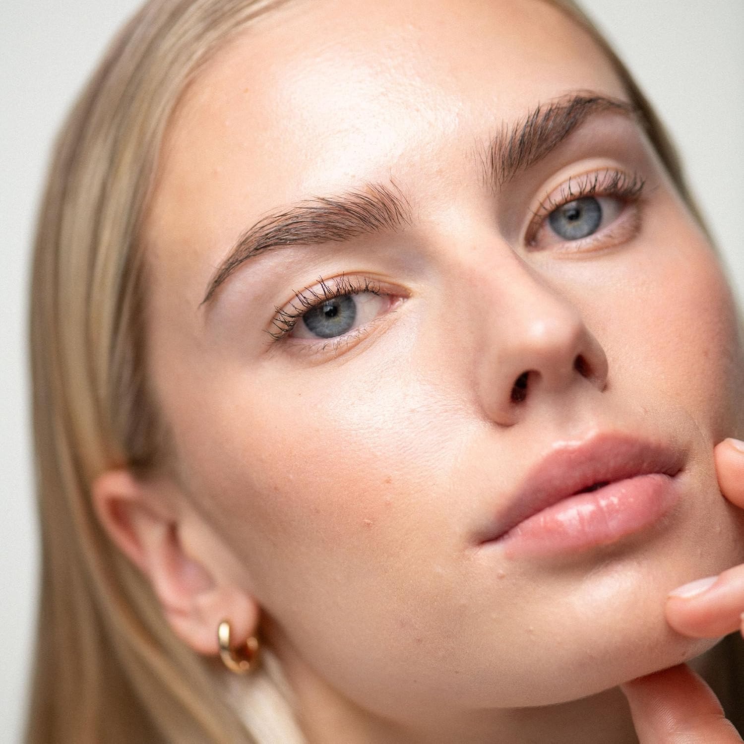 UKLASH lifestyle model wearing extensions showing natural-looking enhanced lashes