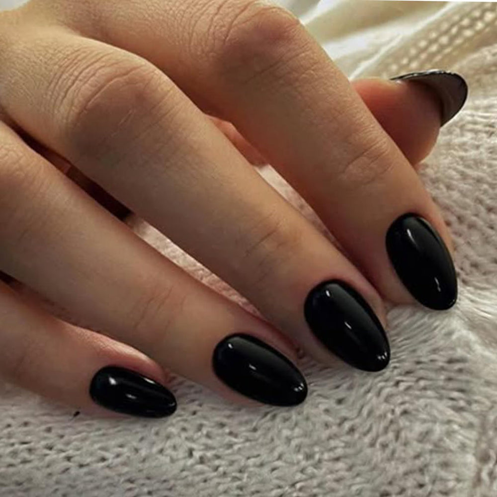 UNA GELLA front packaging showing glossy black almond nails and kit contents