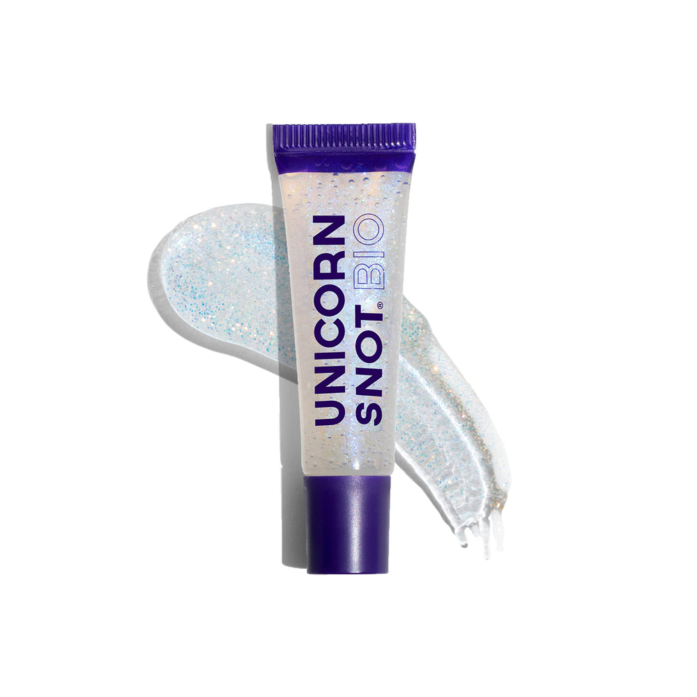UNICORN SNOT lip gloss in festival setting showing bright reflective sparkle and vibe