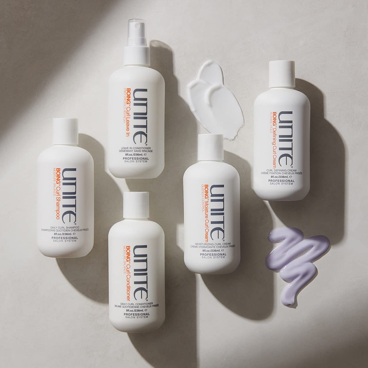 UNITE BOING bottle next to hand showing 8 fl oz size and travel-friendly convenience
