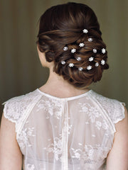 Unittype hair pins placed in a wedding updo demonstrating secure styling benefit