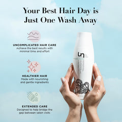 unwash being massaged into wet hair in shower for gentle cleansing benefit