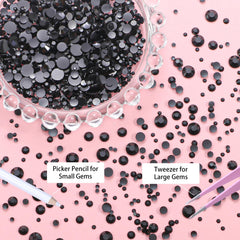 Uotey rhinestones on nail art in progress with pickup tool, precision placement benefit