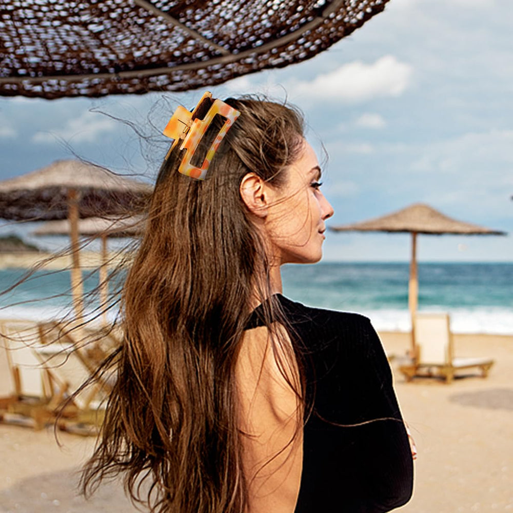 urryKid styled at beach lifestyle image showing bright clips complementing swimwear