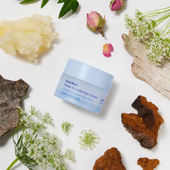 Ursa Major applying cream under eye to show gentle smoothing and de-puffing benefit