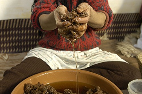 US Organic massaging oil into cuticles to hydrate and improve nail appearance