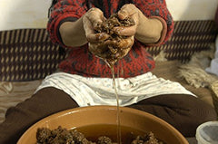 US Organic massaging oil into cuticles to hydrate and improve nail appearance